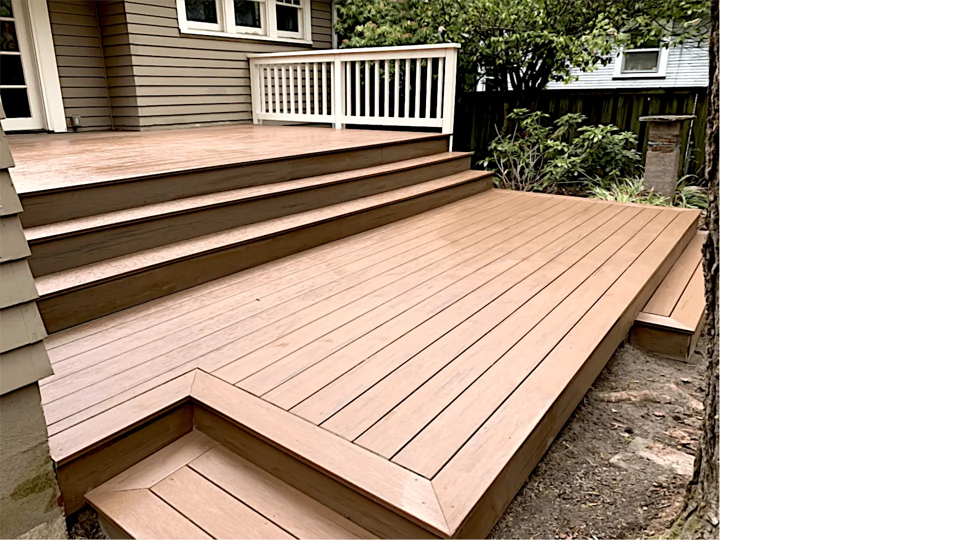 Wide composite deck with wrap-around platform and three full-width steps